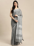 Dark grey woven linen saree with gold zari border and decorative tassels