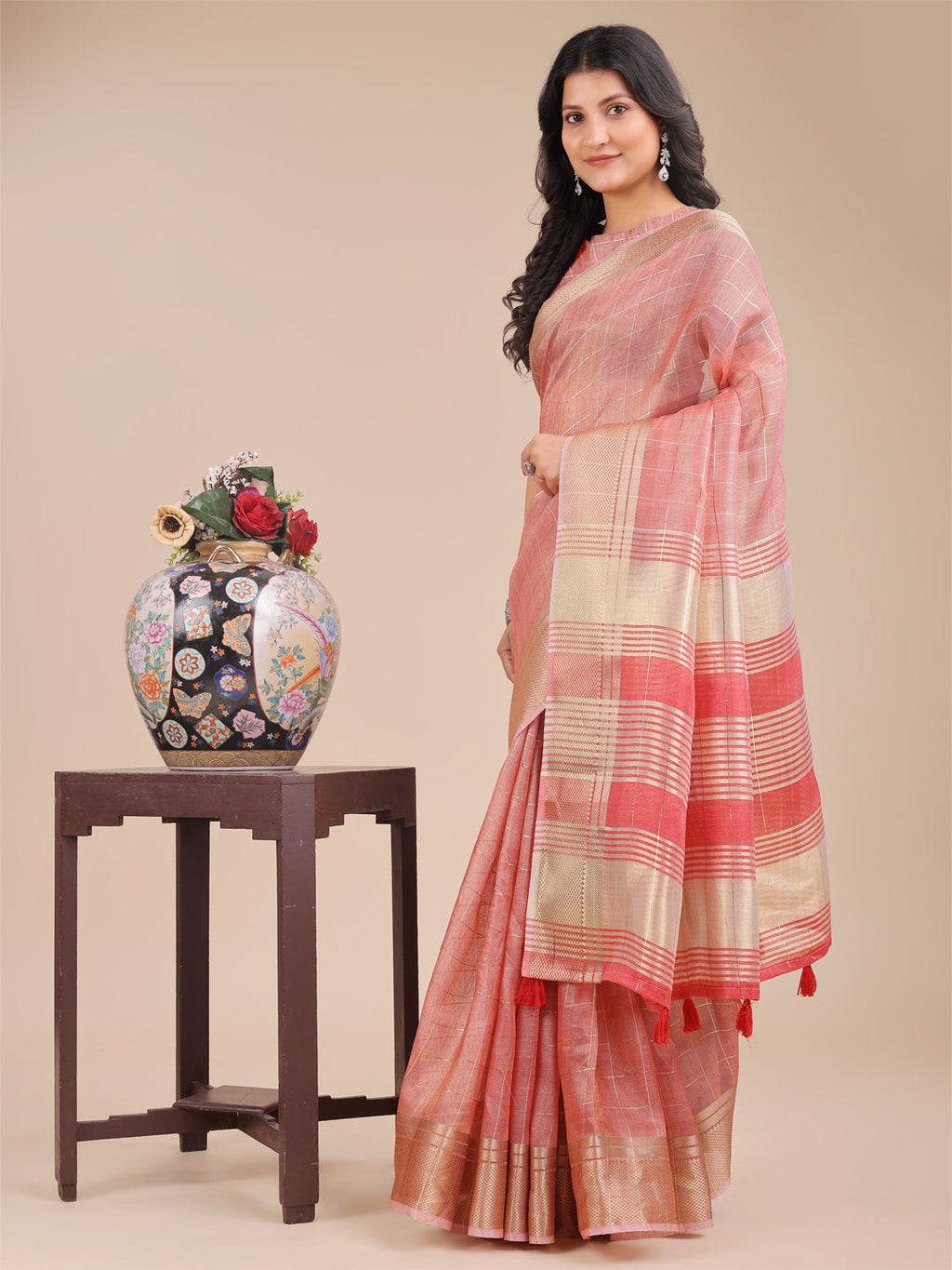 Peach Organza Saree with Woven Zari Work and Tassel Detail