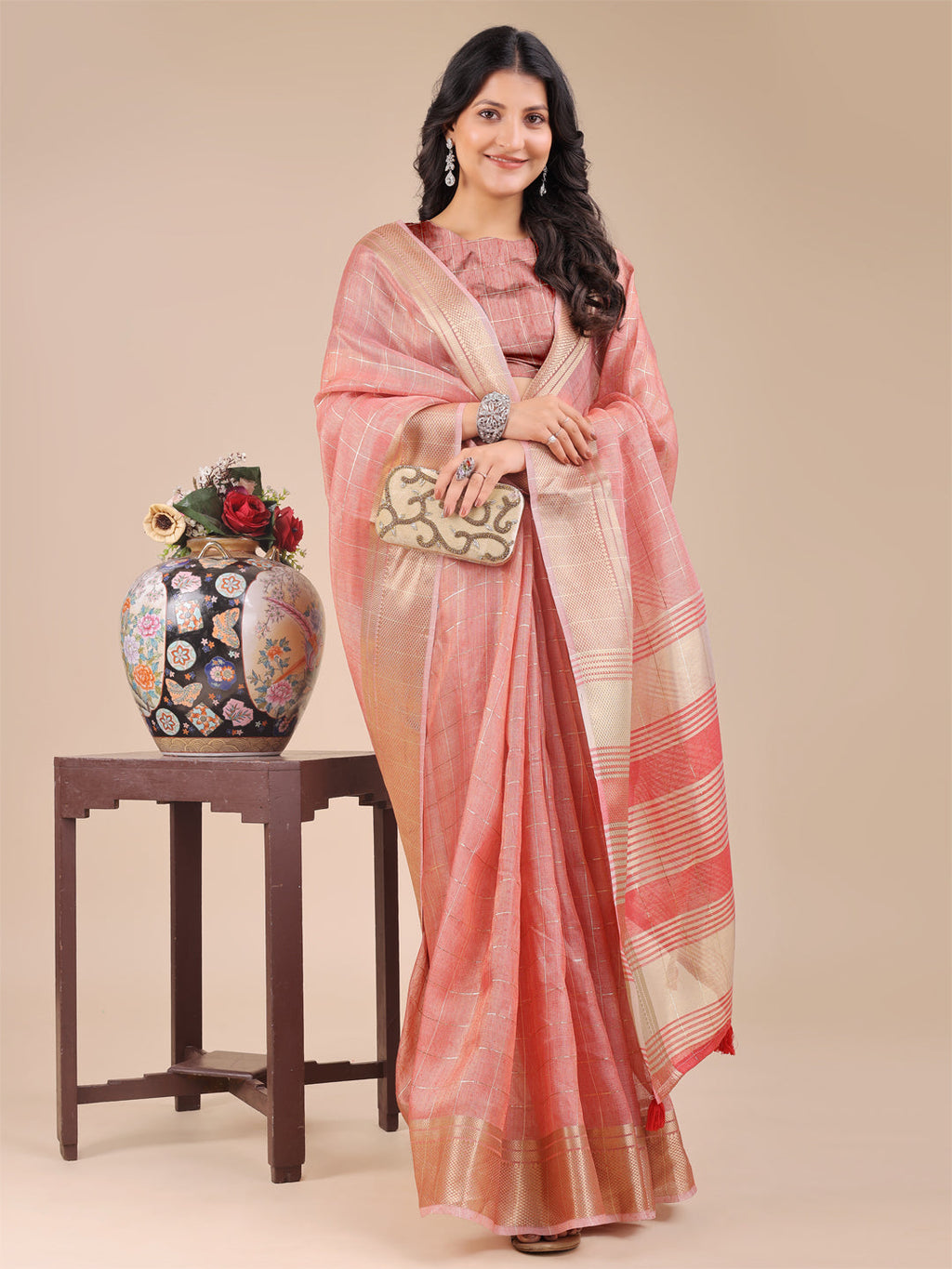 Peach Organza Saree with Woven Zari Work and Tassel Detail
