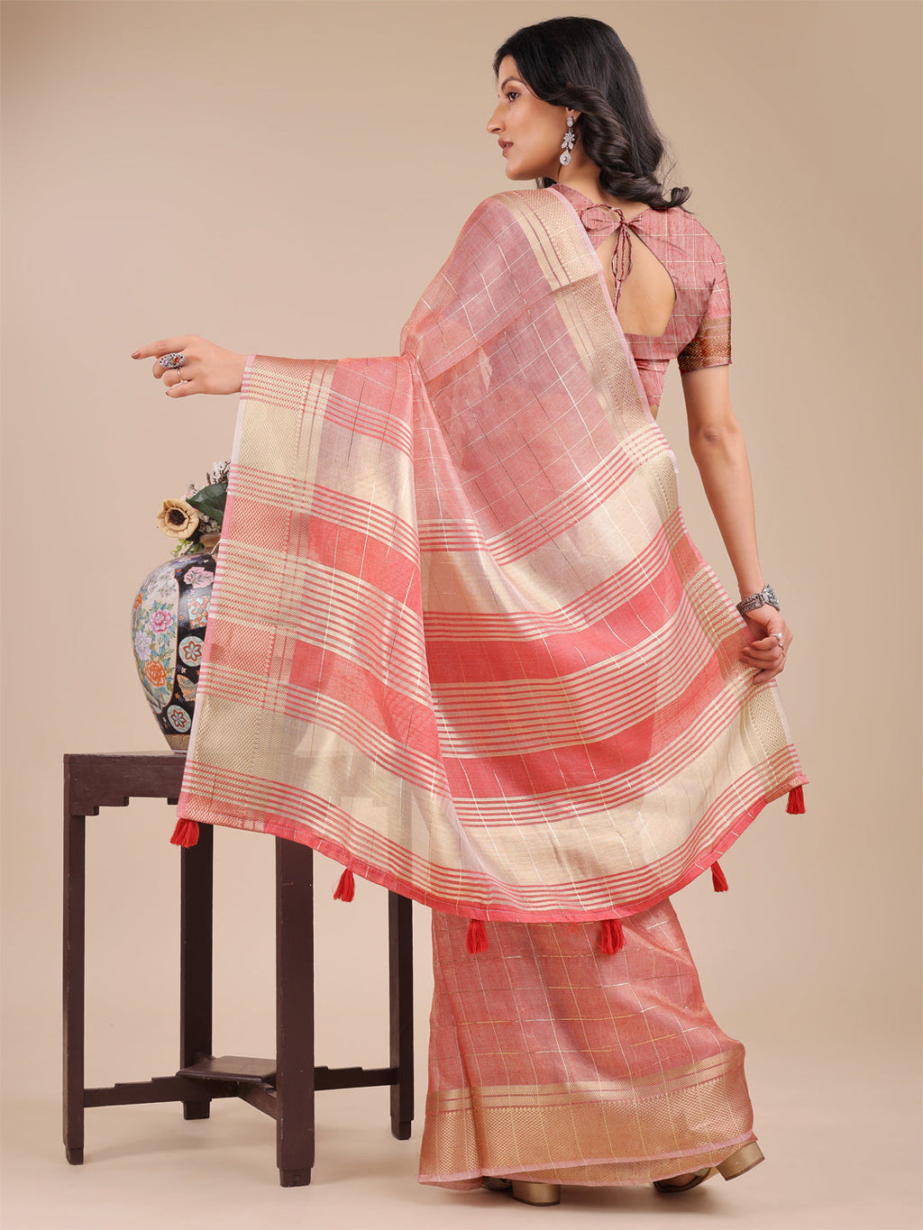 Peach Organza Saree with Woven Zari Work and Tassel Detail