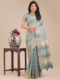 Sea green organza saree with woven zari work and elegant tassel pallu