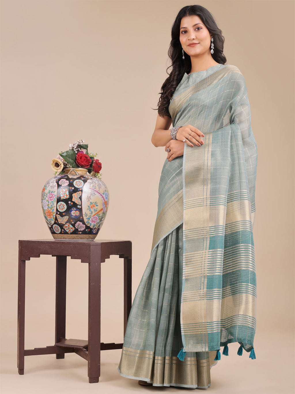 Sea Green Organza Saree with Woven Zari Work and Tassel Detail