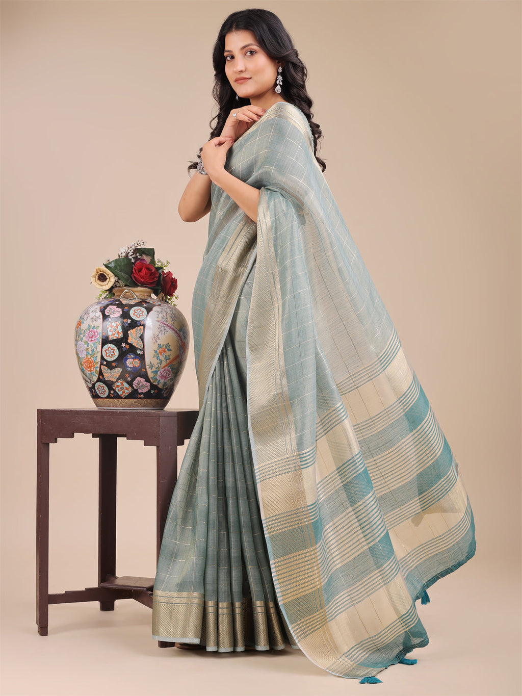 Sea Green Organza Saree with Woven Zari Work and Tassel Detail