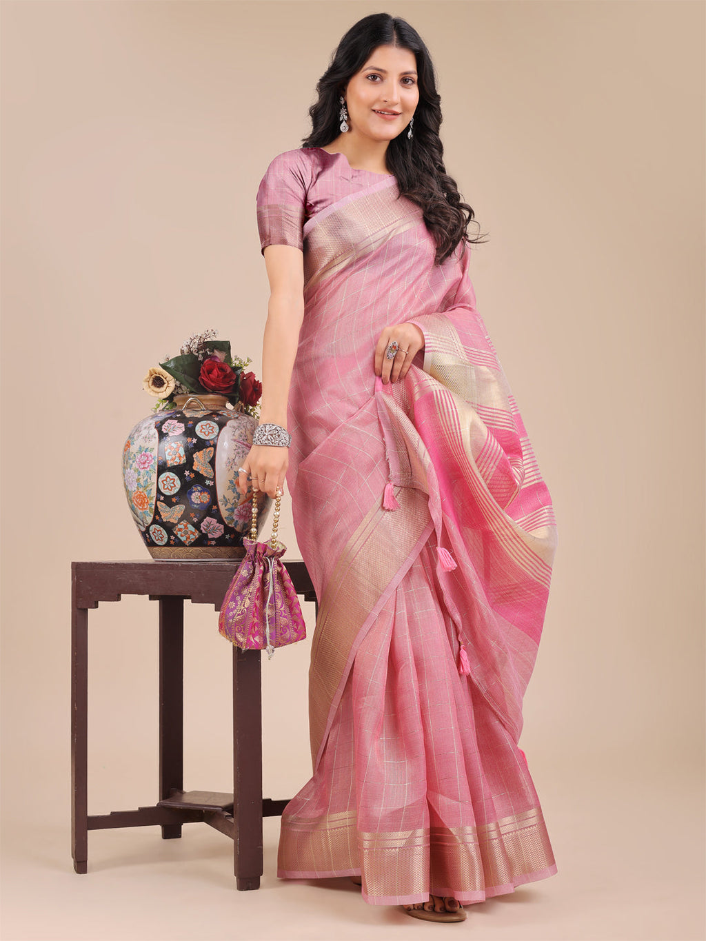 Pink Organza Saree with Woven Zari Work and Tassel Details