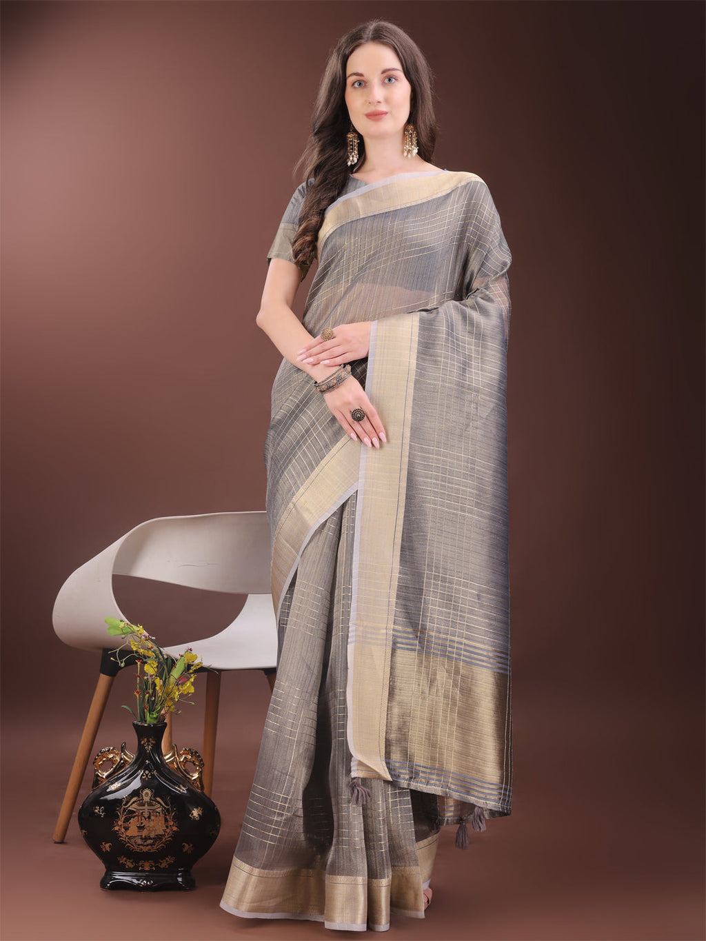 Grey organza saree with a refined gold check pattern.
