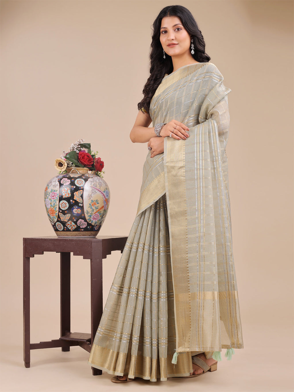 Beige Organza Saree with Woven Zari Work and Traditional Tassels