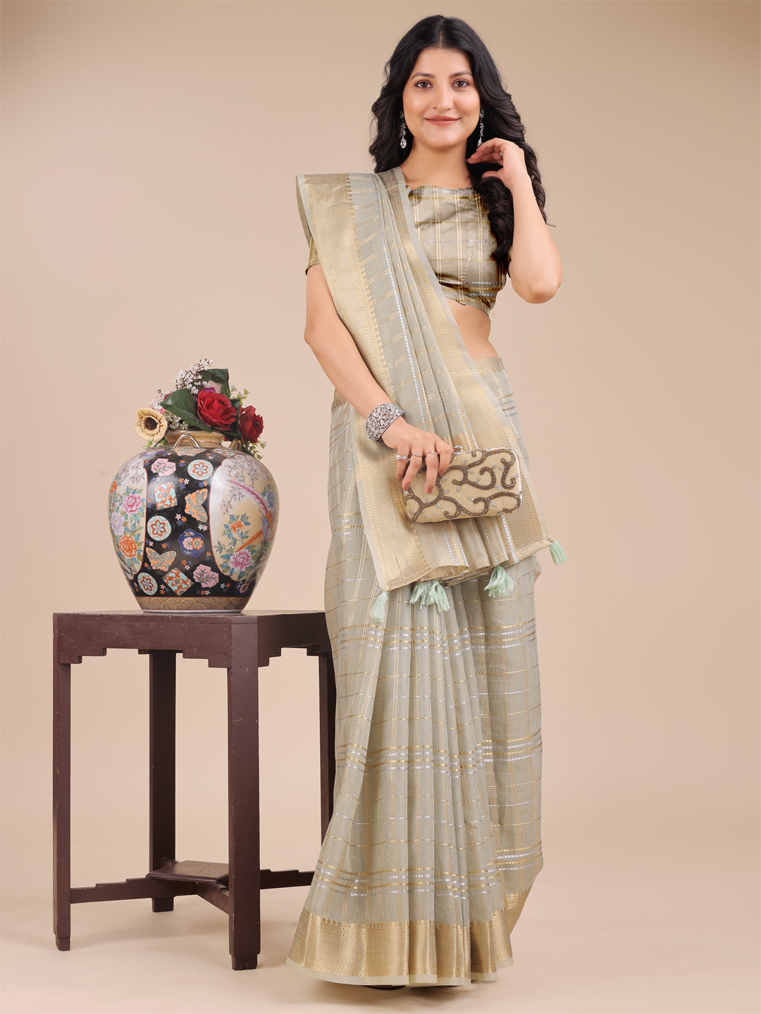 Beige Organza Saree with Woven Zari Work and Traditional Tassels