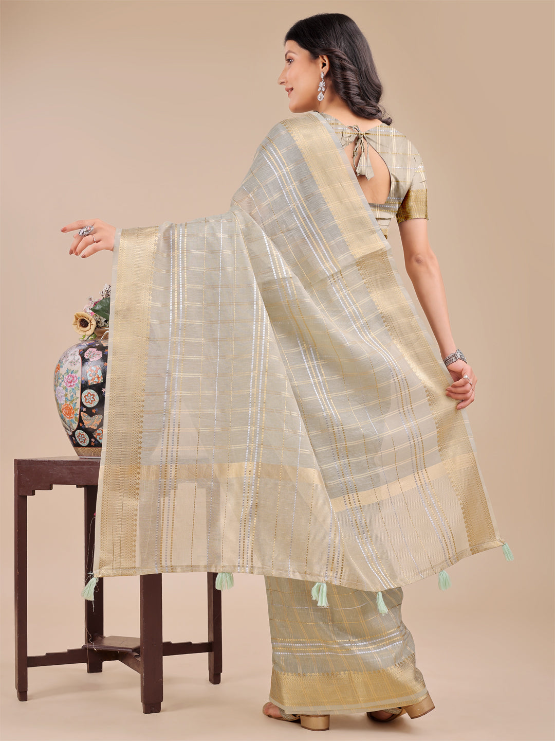 Beige Organza Saree with Woven Zari Work and Traditional Tassels