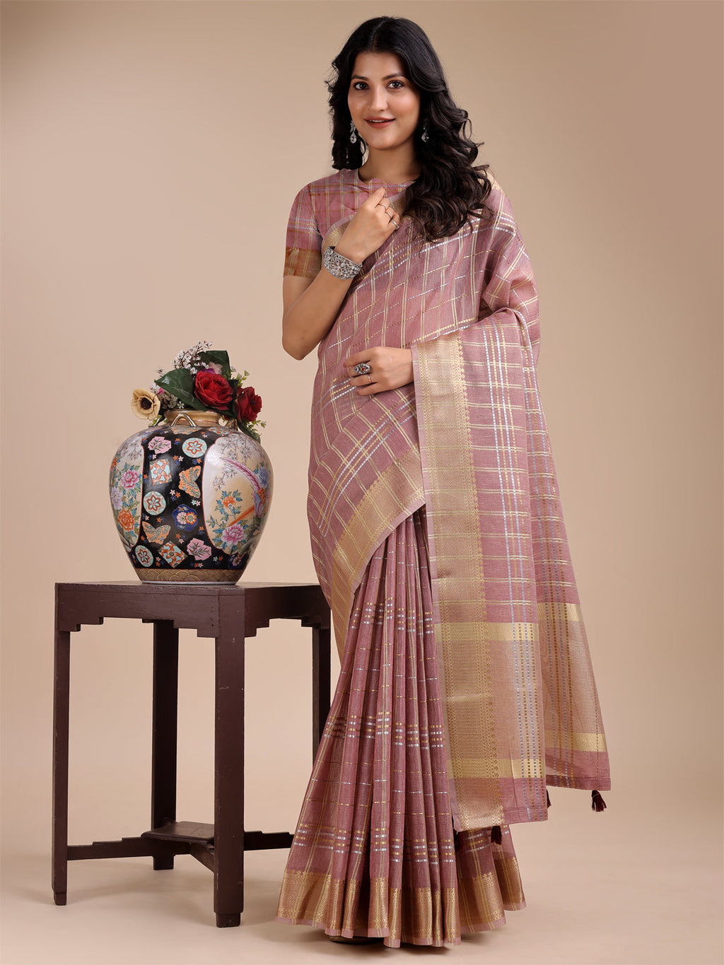 Stunning purple organza saree with woven zari embroidery and tassels