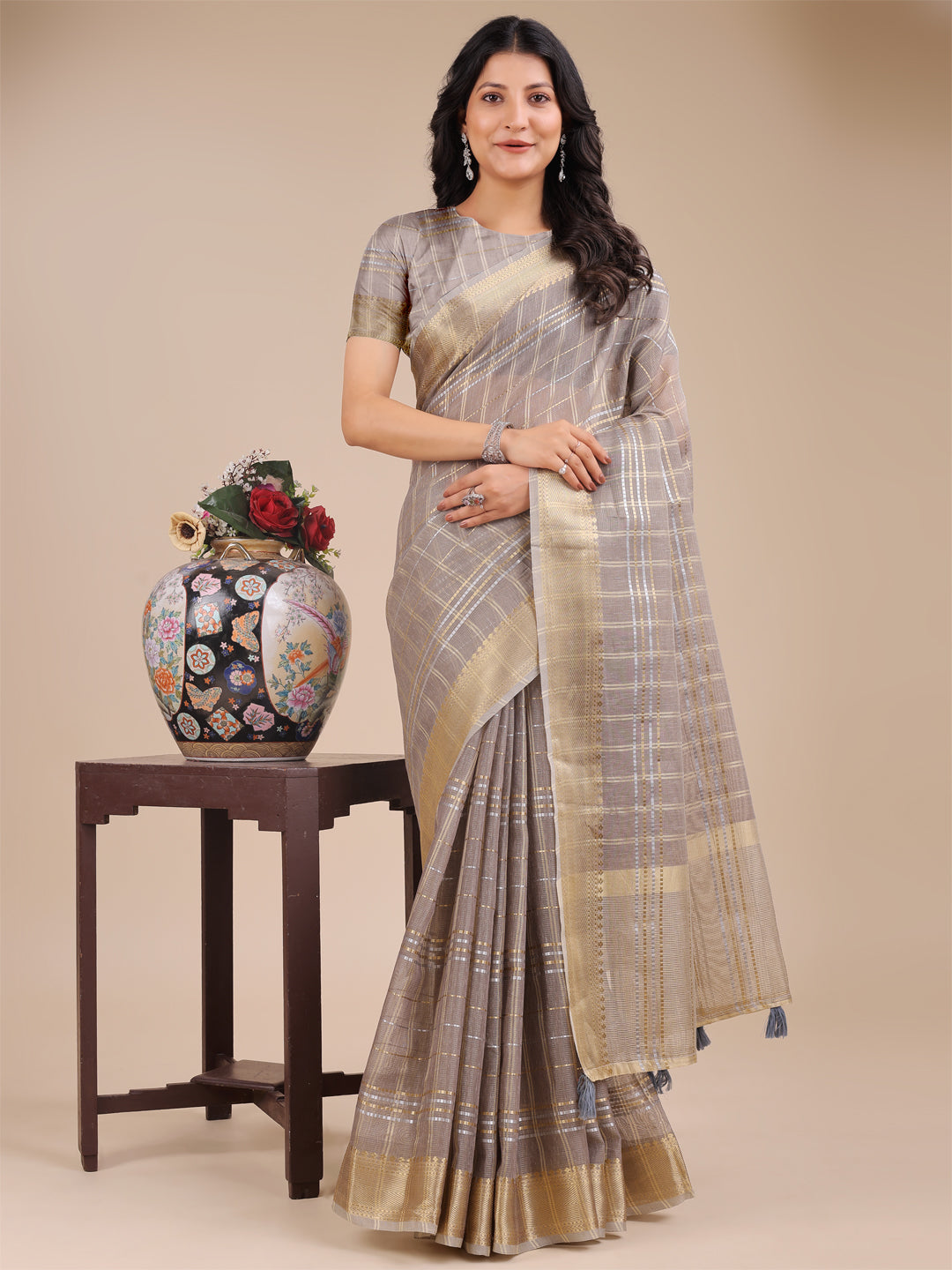 Tan organza saree with woven zari embroidery and tassels