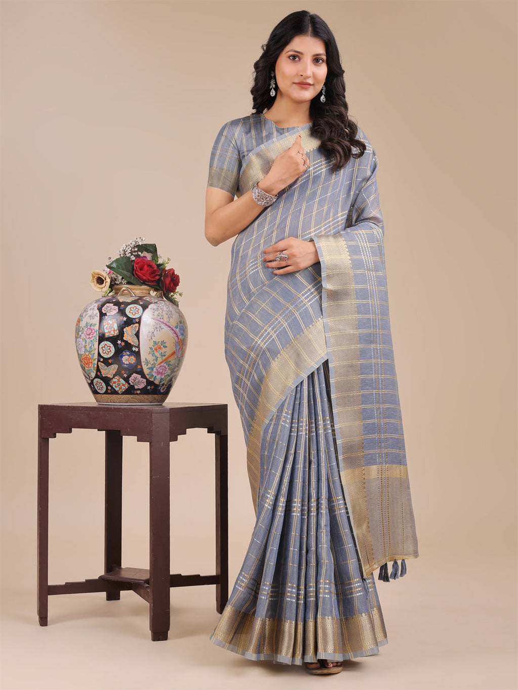 Sky Blue Organza saree with gold woven zari work and traditional tassels