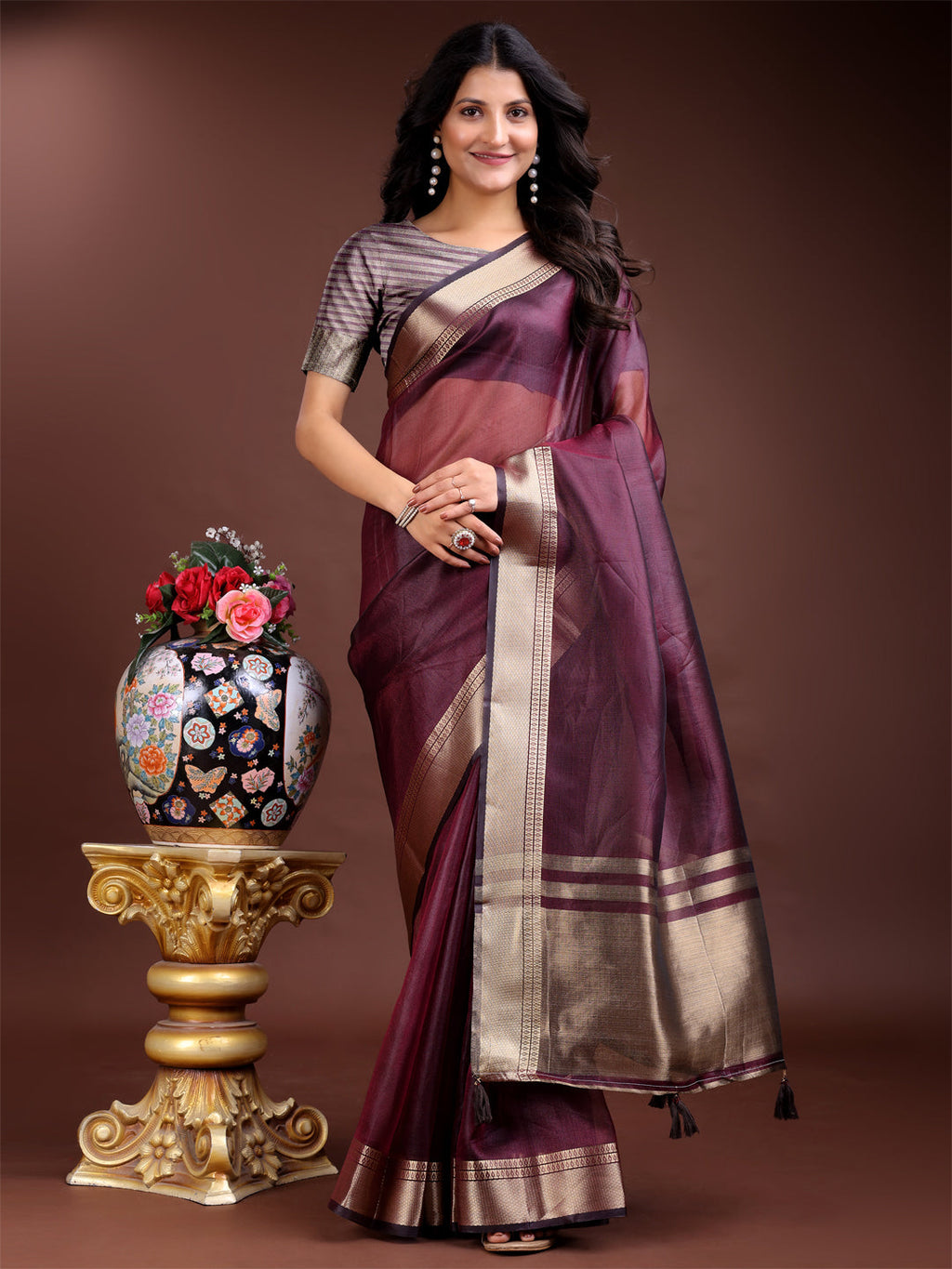Purple organza saree with intricate woven zari work and tassels