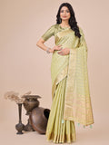 Light green organza saree with woven zari work and traditional tassels