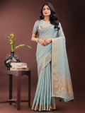 Sky blue organza saree with a traditional golden zari border and matching pallu