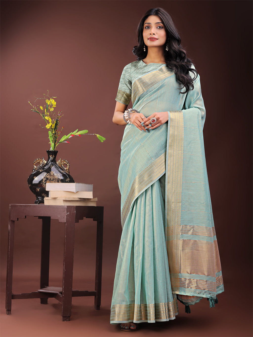 Olive Green Organza saree with traditional golden zari border and matching blouse