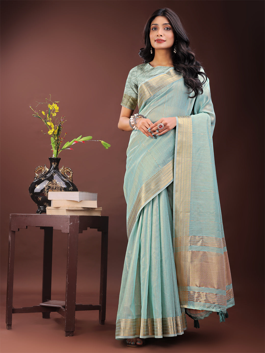 Olive Green Organza saree with traditional golden zari border and matching blouse