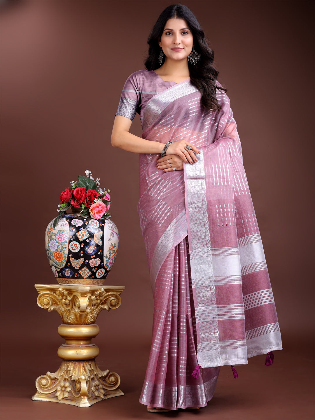 A sophisticated Purple Organza saree with detailed woven zari and traditional pallu tassels.