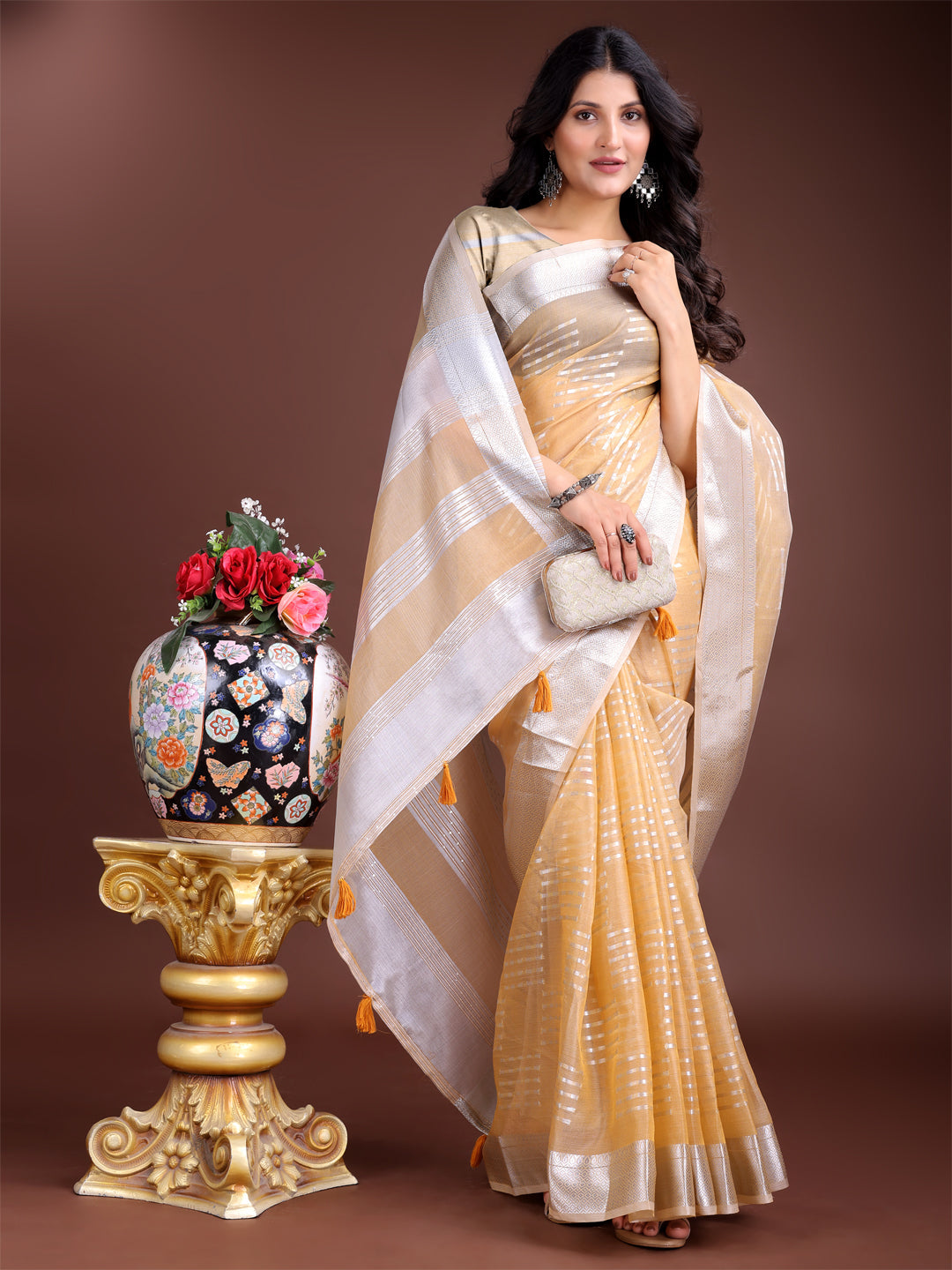 Yellow Organza Saree with Woven Zari Work and Tassel Detail