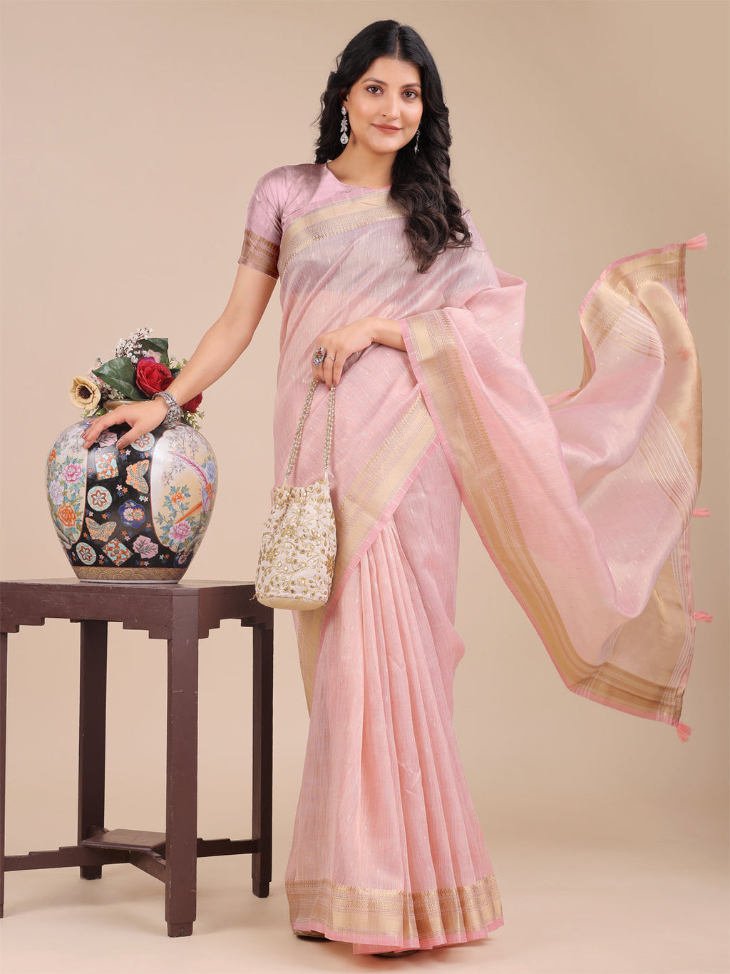 Light Pink Organza Saree with Traditional Woven Zari and Tassels