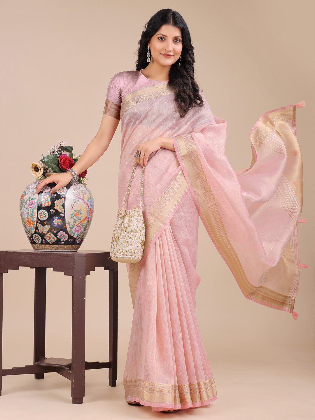 Light Pink Organza Saree with Traditional Woven Zari and Tassels