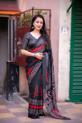 Black silk blend saree with batik prints and matching unstitched blouse