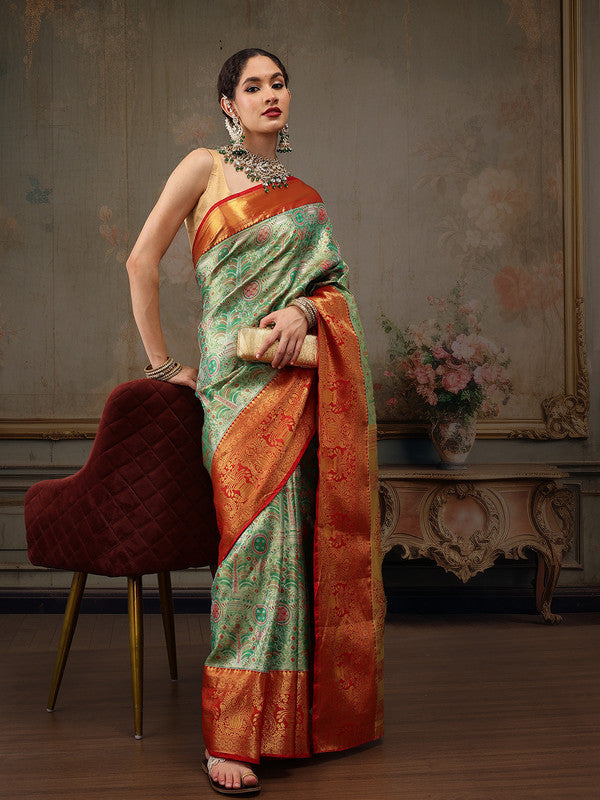 Close up of Green Pure Silk saree showing floral woven Zari details