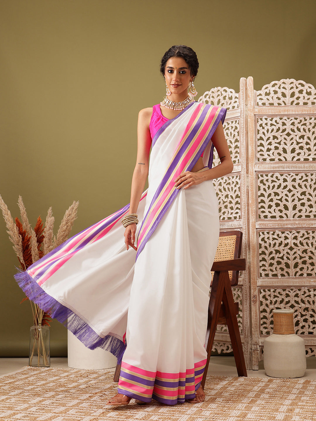 Elegant white Banarasi soft silk solid saree draped perfectly