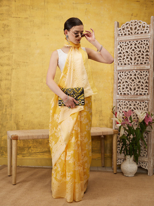 Yellow cotton saree featuring floral zari motifs and matching blouse fabric