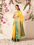 Vibrant yellow Banarasi silk saree with intricate woven traditional patterns.