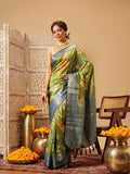 Close up of vibrant green Banarasi silk saree with floral digital printing