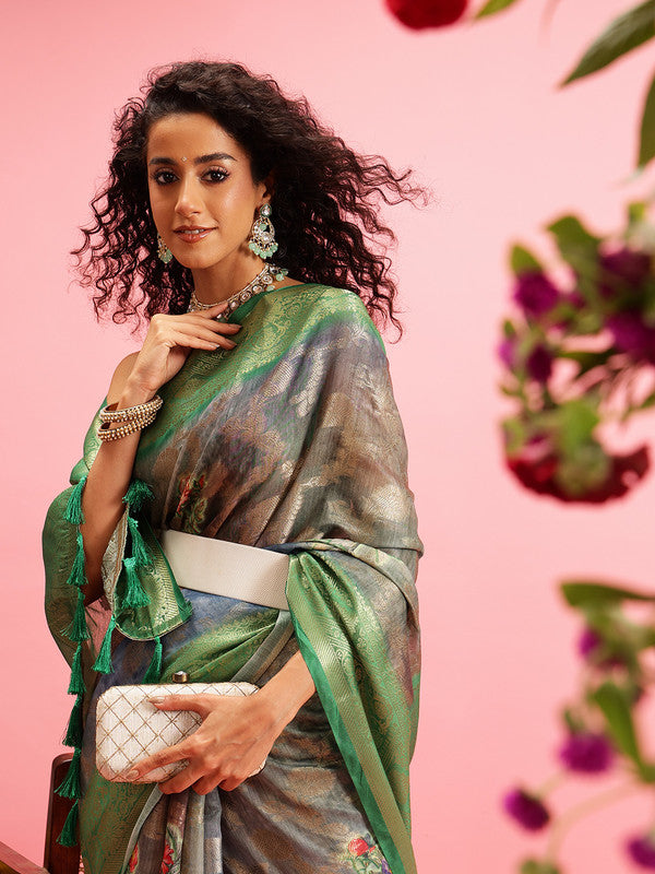 Green cotton saree featuring a vibrant digital floral print and matching unstitched blouse