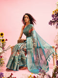 Turquoise floral print cotton saree accompanied by an unstitched blouse piece.