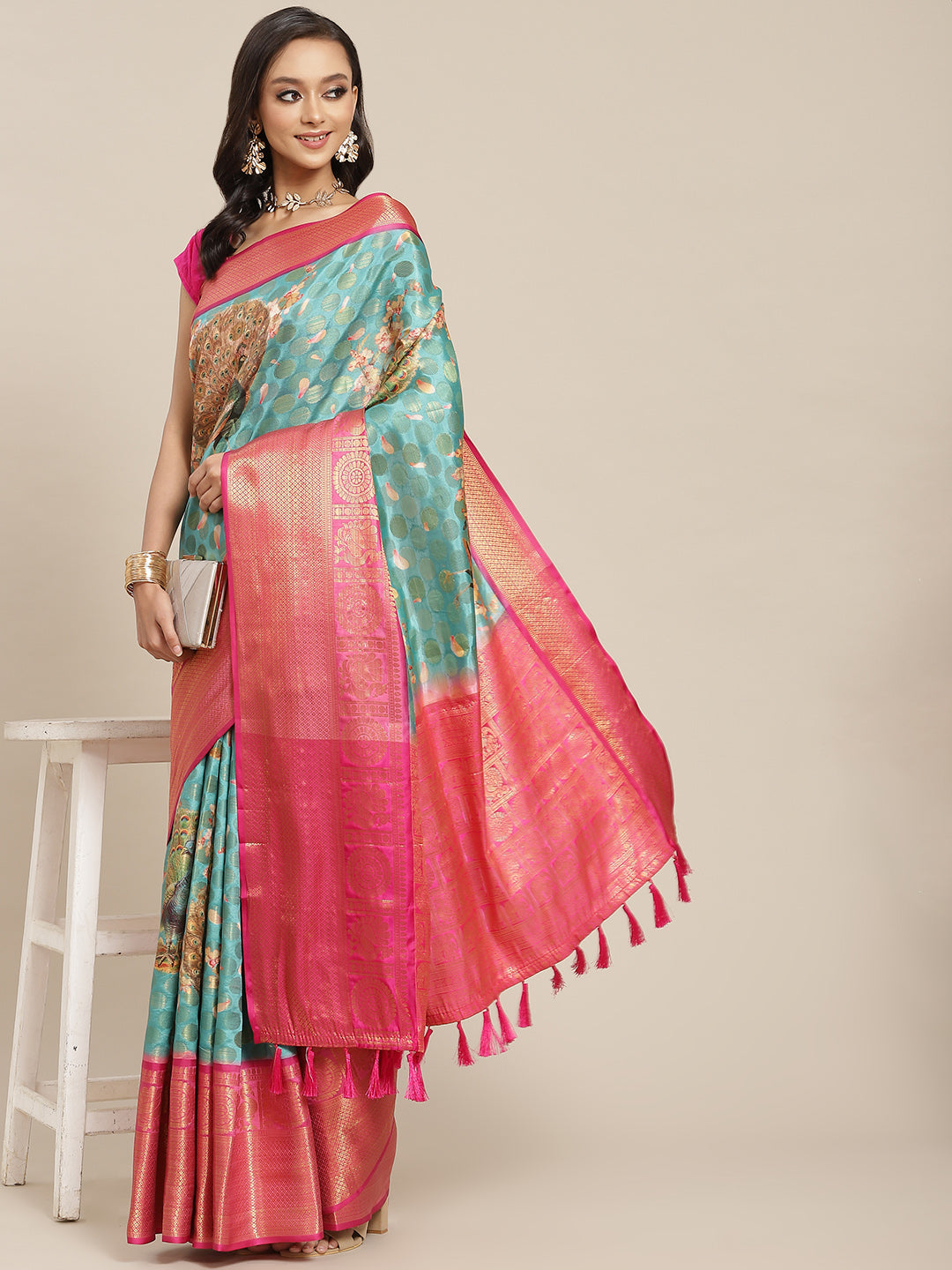 Turquoise art silk saree featuring a fun polka dot pattern with matching unstitched blouse