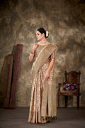Beige art silk saree with floral prints and an unstitched blouse piece