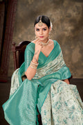 Turquoise Art Silk Saree with a vibrant floral print and matching unstitched blouse.