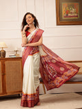 Sophisticated off-white Kotha silk saree with detailed floral digital prints.