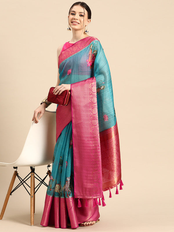 Turquoise Munga Silk saree with an eye-catching animal print pattern.