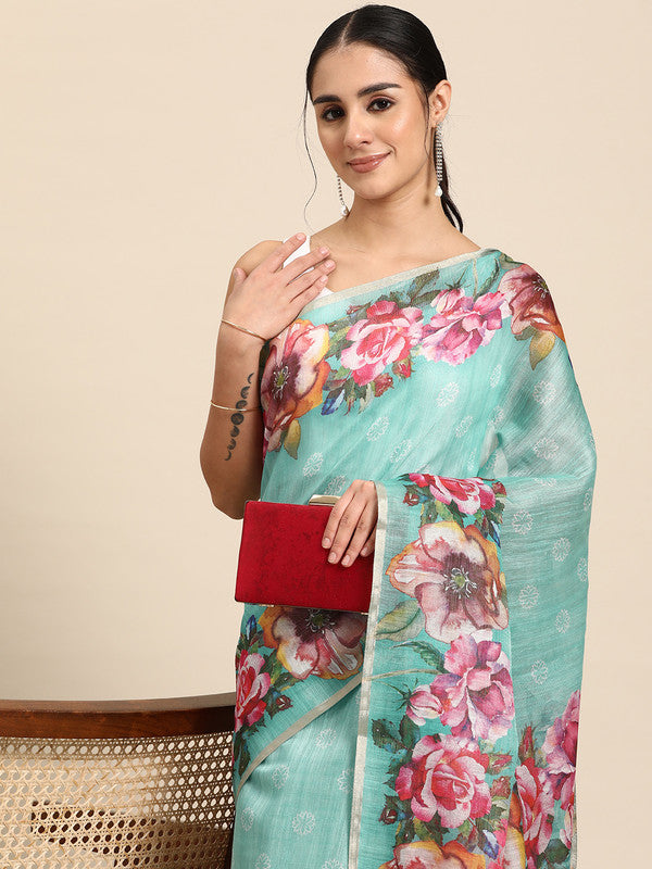 Turquoise cotton blend saree with vibrant digital floral print and matching unstitched blouse piece.