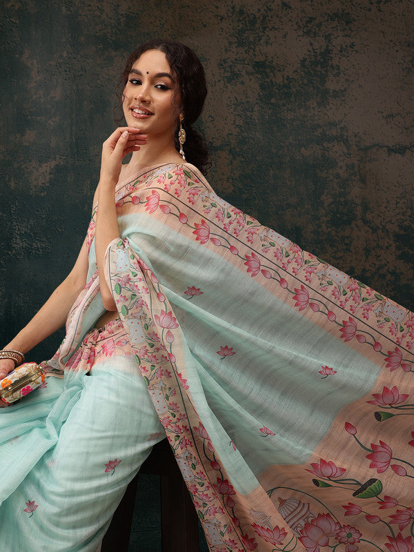 Turquoise cotton blend saree with a modern digital animal print and an included unstitched blouse.