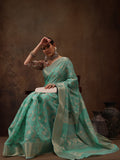 Turquoise cotton saree with woven zari floral patterns and unstitched blouse
