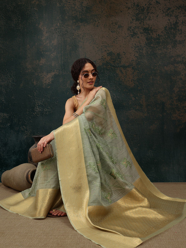 Green Kota Doria saree with floral embroidery and unstitched blouse