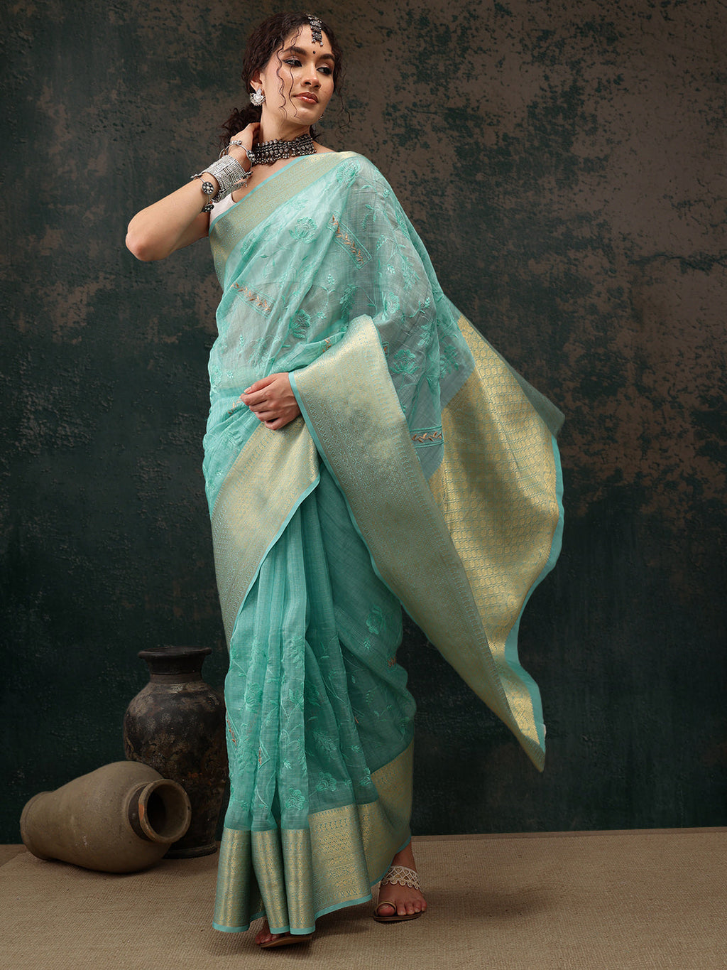 Turquoise Kota Doria saree with floral embroidery and unstitched blouse