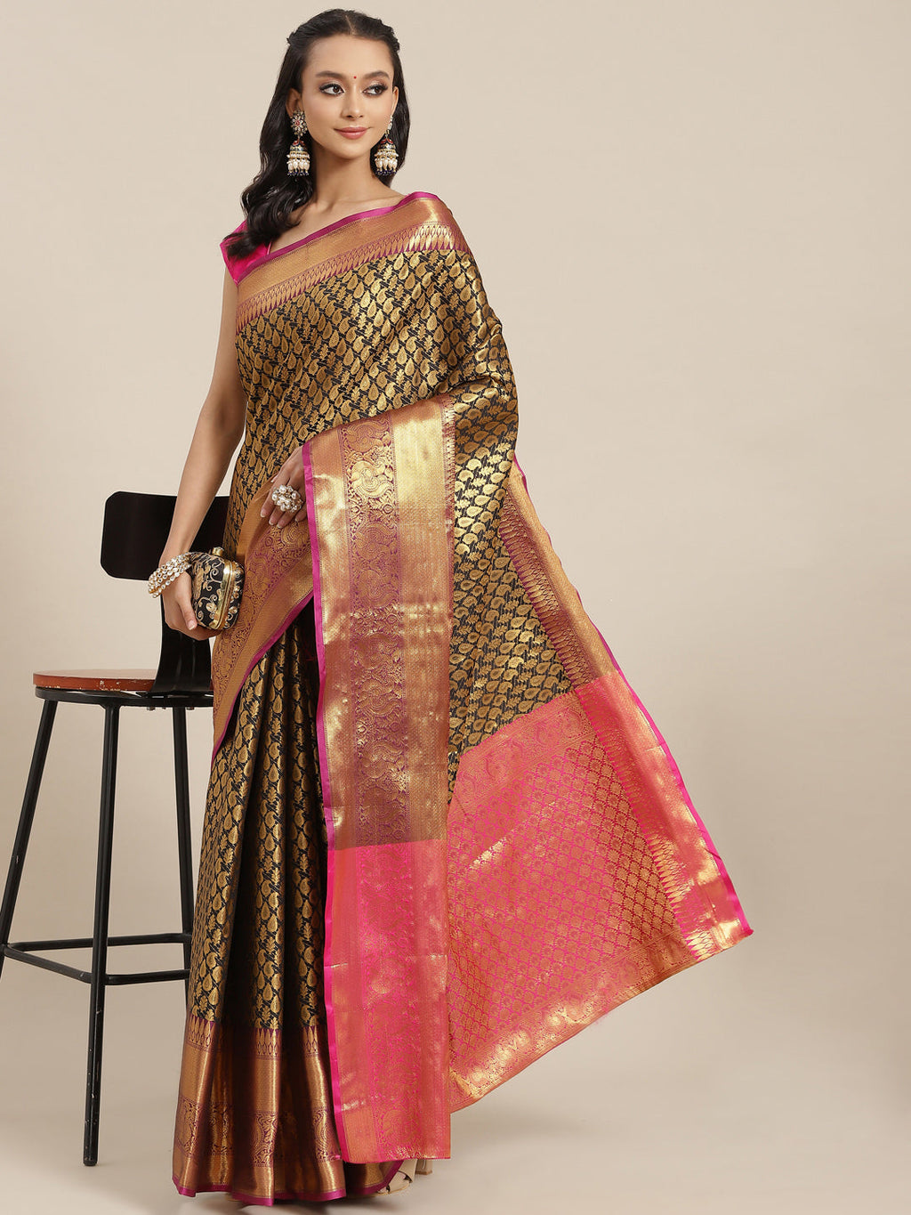 Black brocade saree featuring paisley zari woven design with unstitched blouse