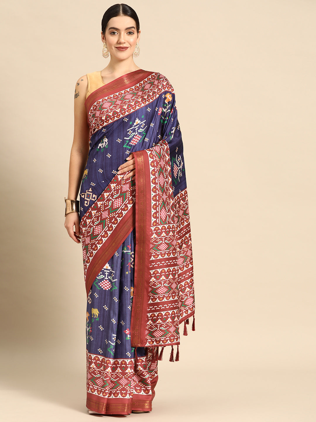 Navy blue silk blend saree featuring digital Patola patterns and unstitched blouse