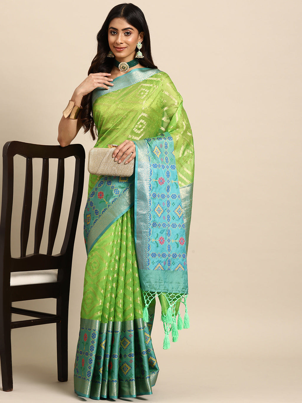 Green silk blend saree with geometric zari motifs and unstitched blouse