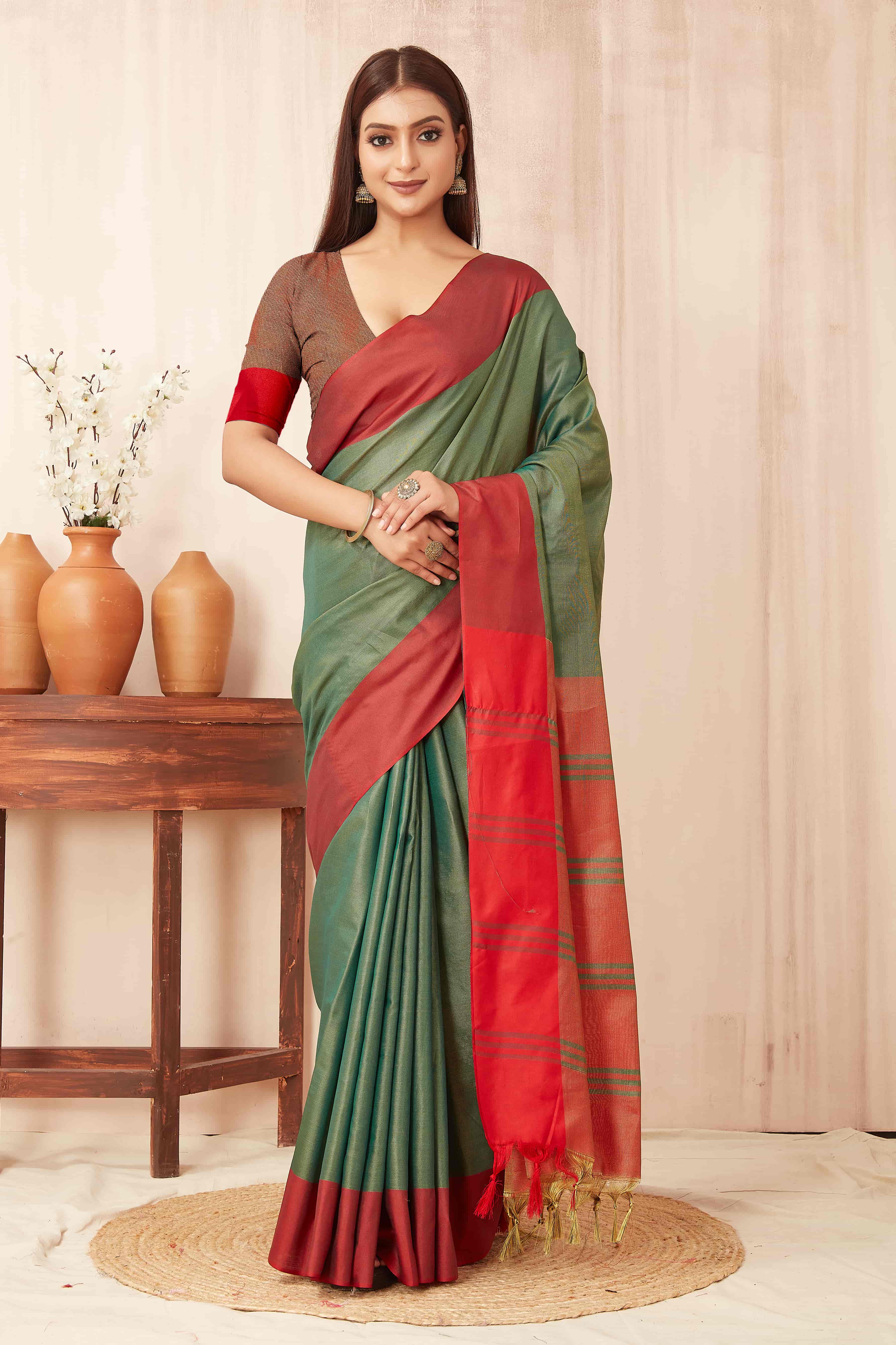 Solid green Banarasi soft silk saree with a smooth, elegant finish