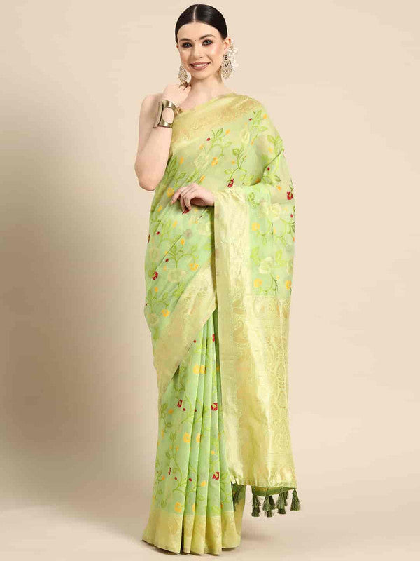 Green pure cotton saree with floral pattern and zari work, paired with unstitched blouse piece.