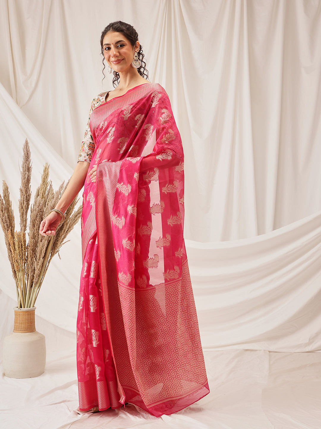Elegant pink Banarasi organza silk saree featuring delicate floral weaving