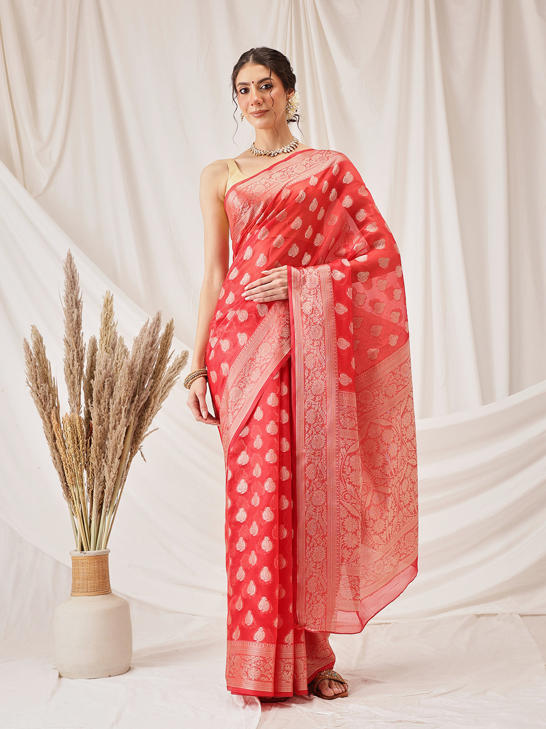 Red Banarasi Organza Silk saree featuring floral woven patterns