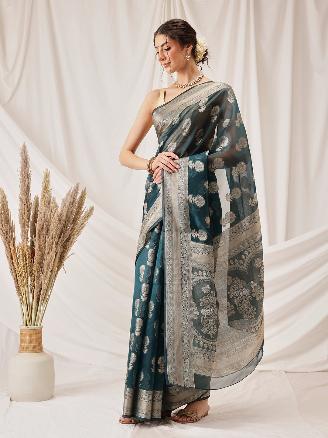 Teal Banarasi Organza Silk saree with floral woven detailing